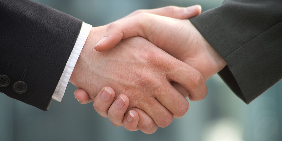 two businessman shake hands