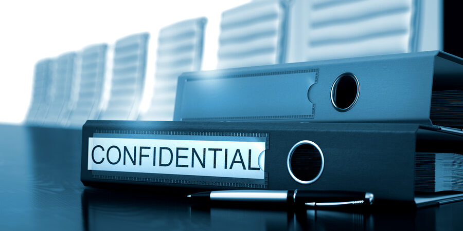 Confidential. Concept on Toned Background. Confidential - Folder on Black Desktop. Office Binder with Inscription Confidential on Desktop. Confidential - Business Concept. Toned Image. 3D Render.