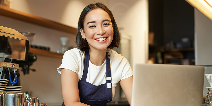 bigstock-Enthusiastic-Asian-Girl-In-Caf-467341295