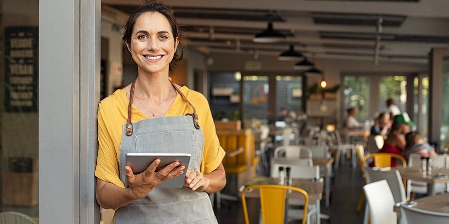 bigstock-Portrait-of-happy-woman-standi-336618316