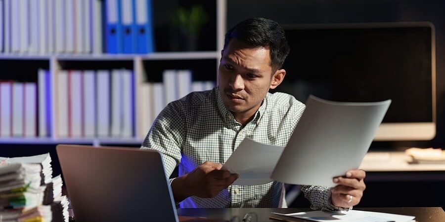 bigstock-Stressed-Business-Man-Working-463791189